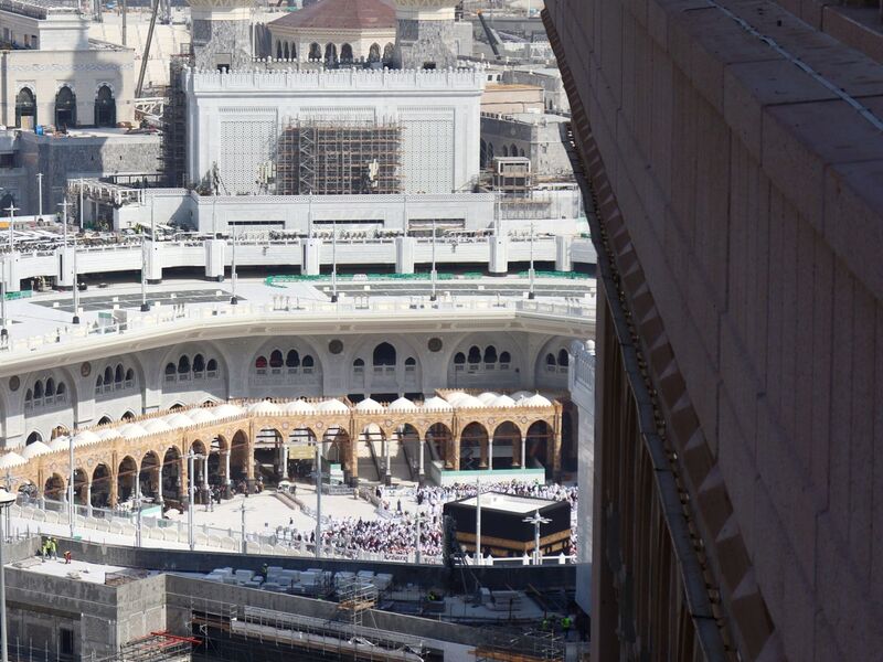 Partial Kaaba view from a hotel room, with a tower edge clipping part of the outlook